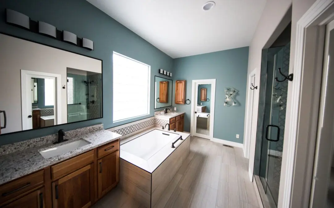 Spacious modern bathroom featuring a freestanding bathtub, wooden cabinets, and granite countertops.