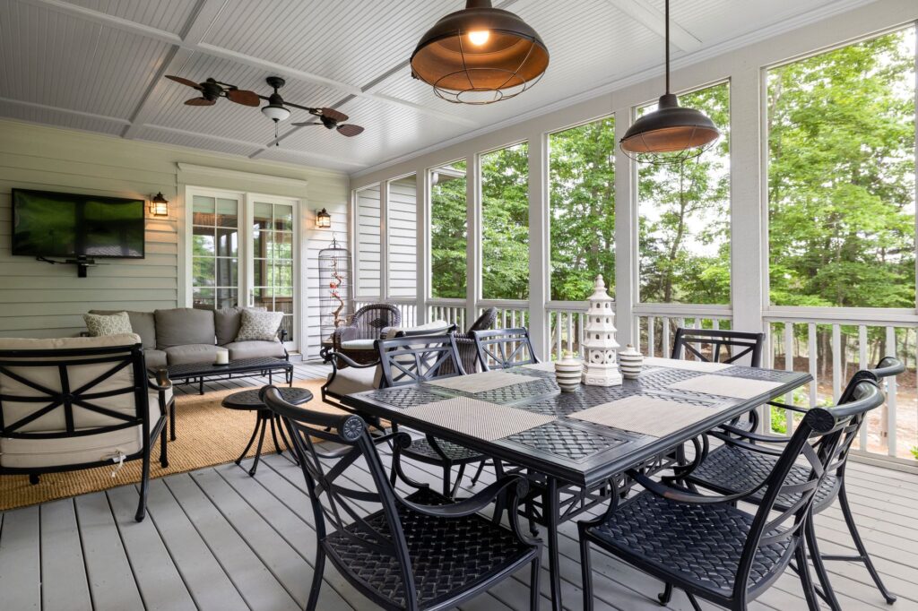 Spacious outdoor patio featuring elegant furniture with a scenic view, perfect for relaxing.