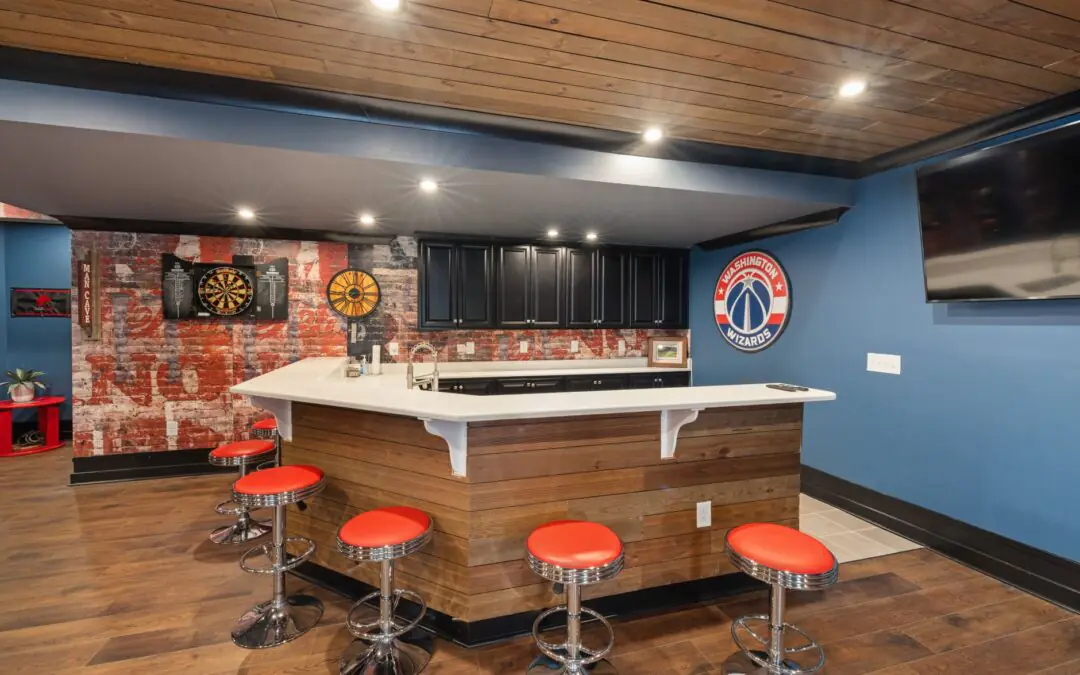Stylish home bar with vibrant decor, featuring a Washington Wizards theme, dart board, and red bar stools.