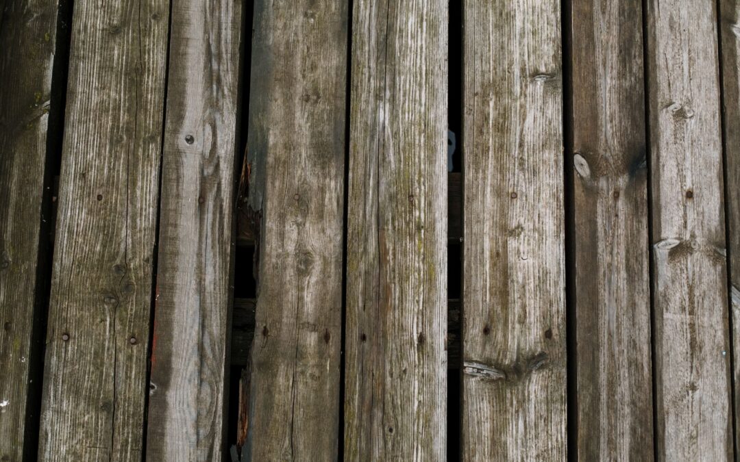 Close-up of aged wooden planks, ideal for rustic or natural-themed flooring designs.